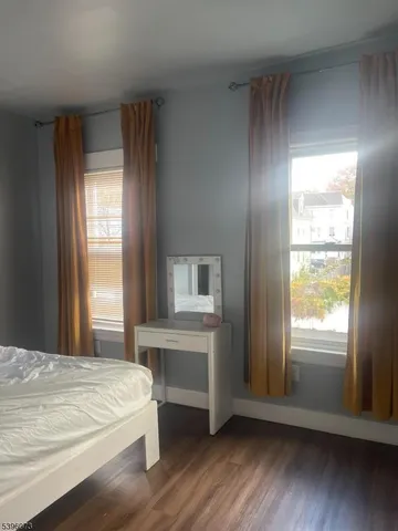 a room with a bed and a window