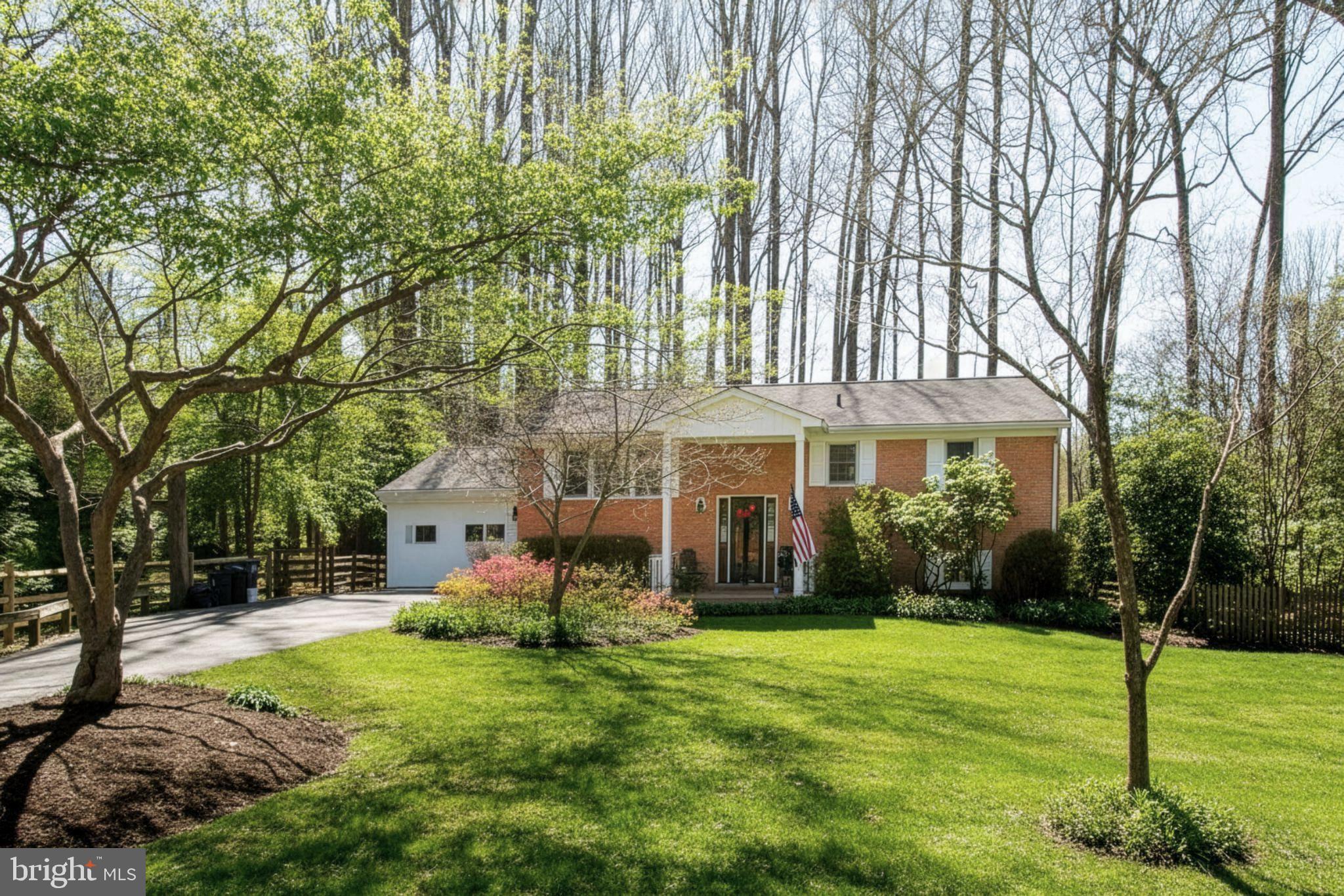 12415 Caisson Road Fairfax, VA 22030 - Photo 1 of 39 a front view of a house with a yard