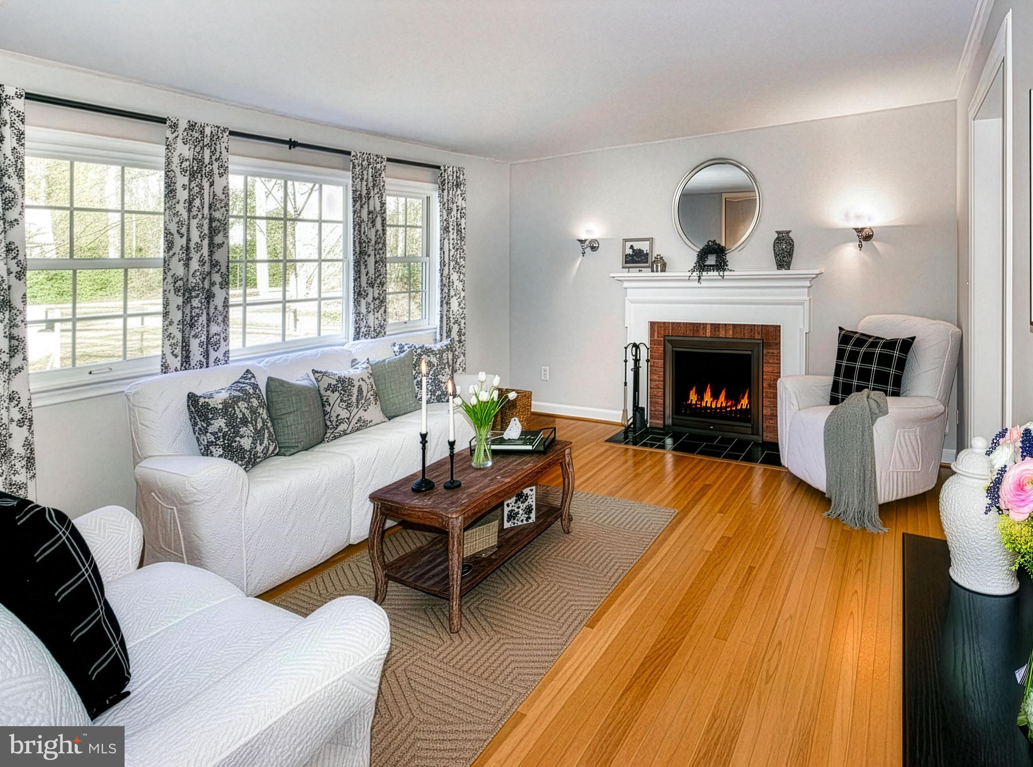 12415 Caisson Road Fairfax, VA 22030 - Photo 13 of 39 a living room with furniture and a fireplace