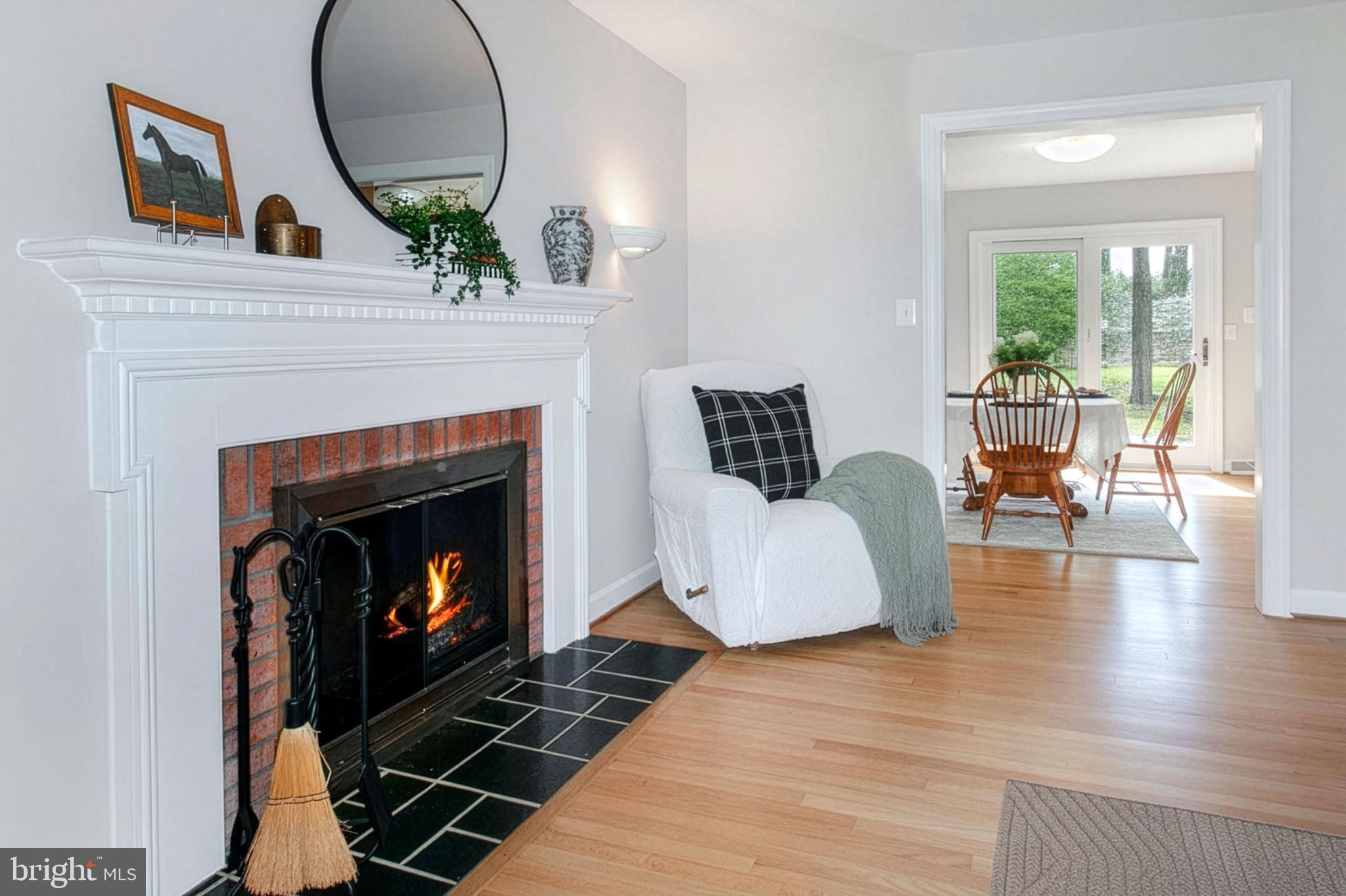 12415 Caisson Road Fairfax, VA 22030 - Photo 15 of 39 a living room with furniture and a fireplace
