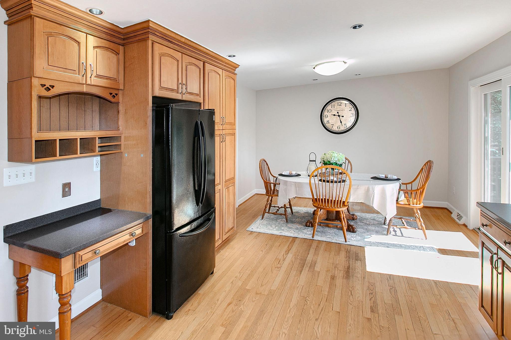 12415 Caisson Road Fairfax, VA 22030 - Photo 17 of 39 a dining room with furniture and wooden floor