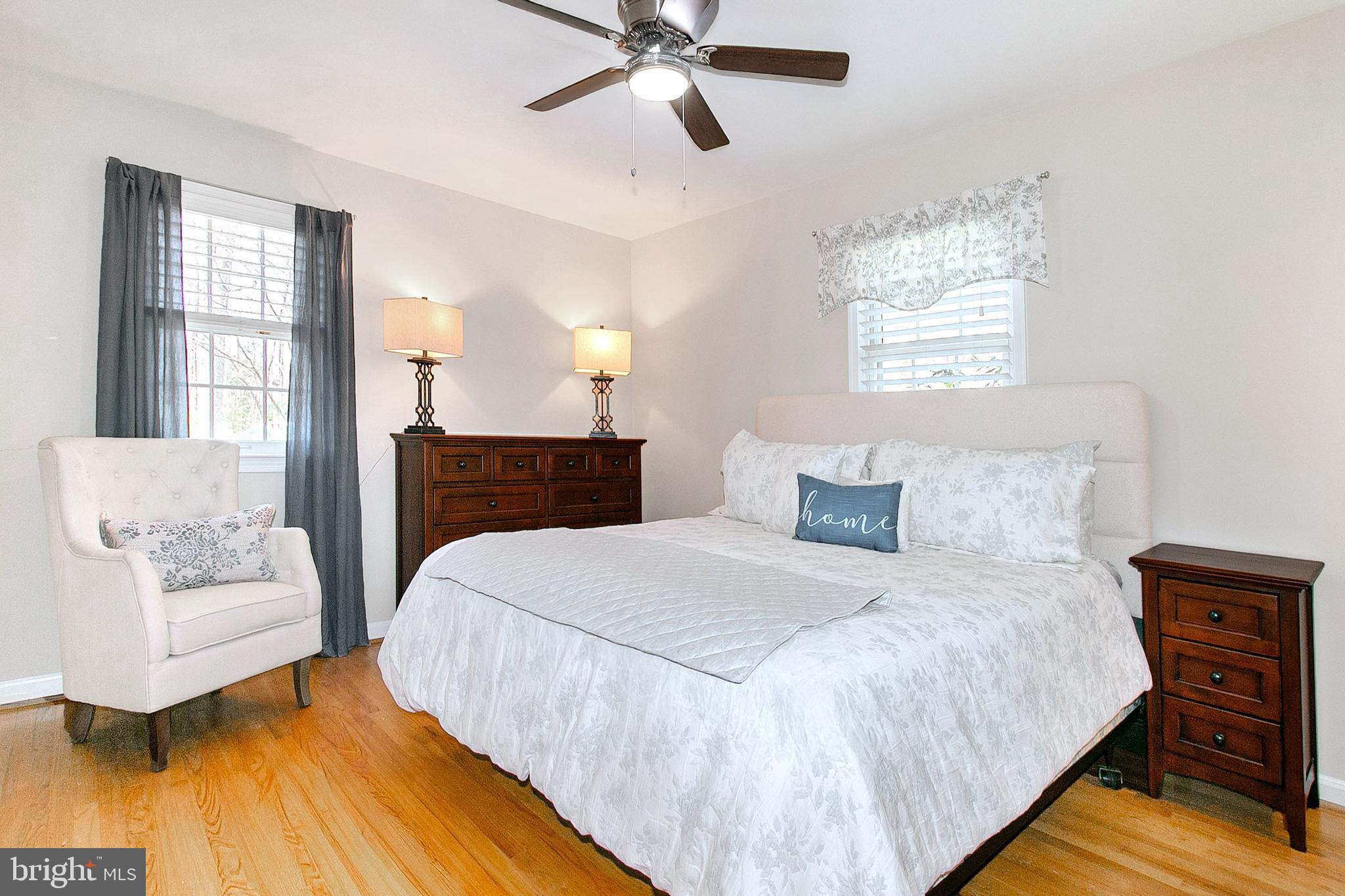 12415 Caisson Road Fairfax, VA 22030 - Photo 19 of 39 a bedroom with a bed and wooden floor