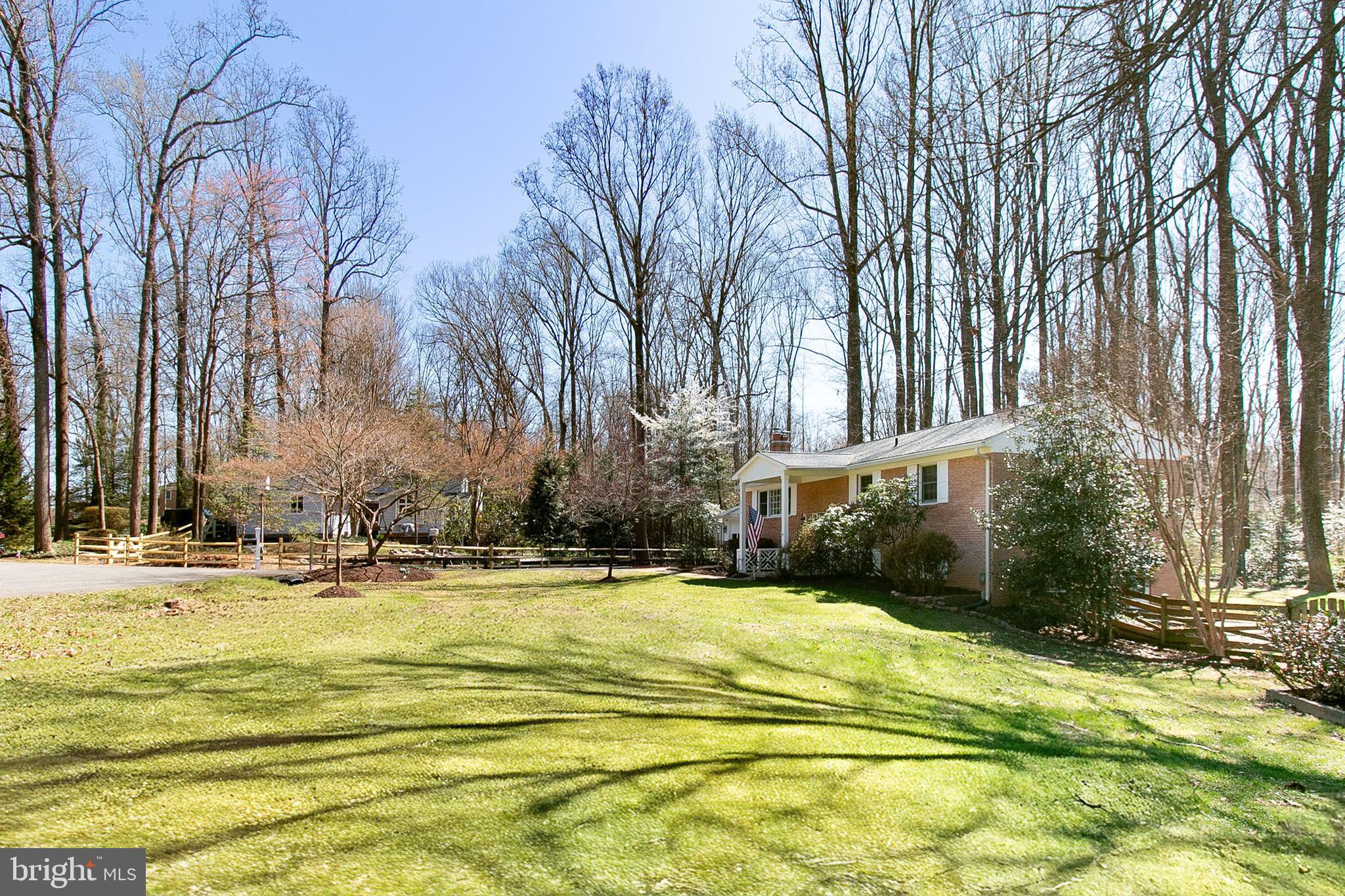 12415 Caisson Road Fairfax, VA 22030 - Photo 2 of 39 a view of a swimming pool with an outdoor space and seating area