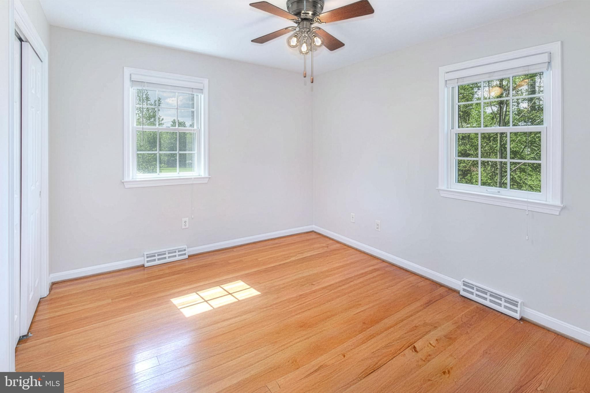 12415 Caisson Road Fairfax, VA 22030 - Photo 24 of 39 a view of empty room with wooden floor and fan