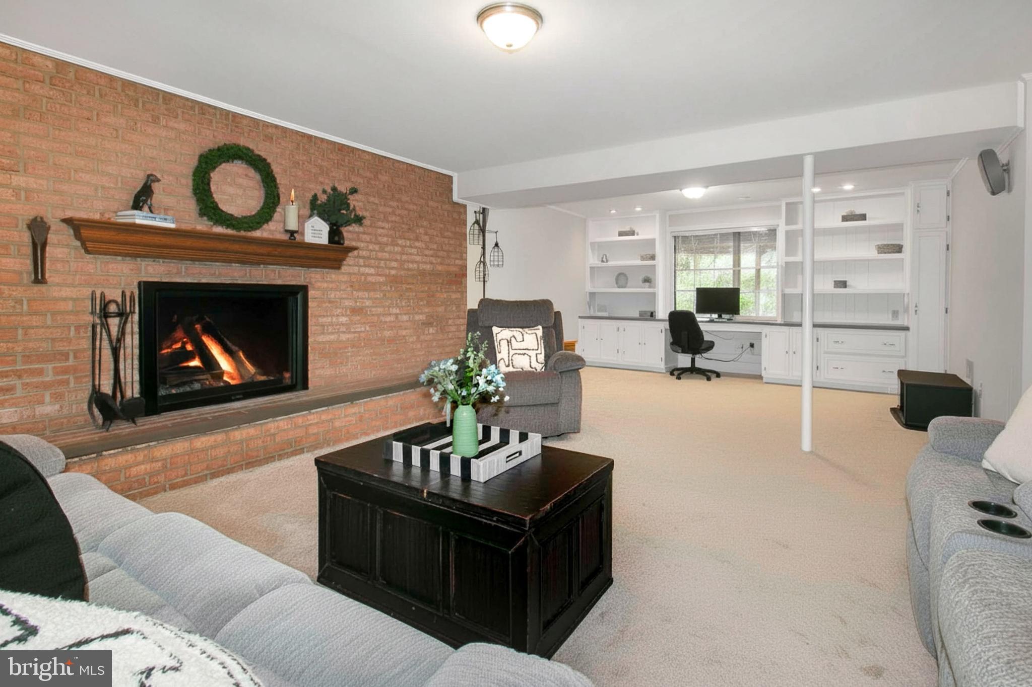 12415 Caisson Road Fairfax, VA 22030 - Photo 27 of 39 a living room with furniture and a fireplace