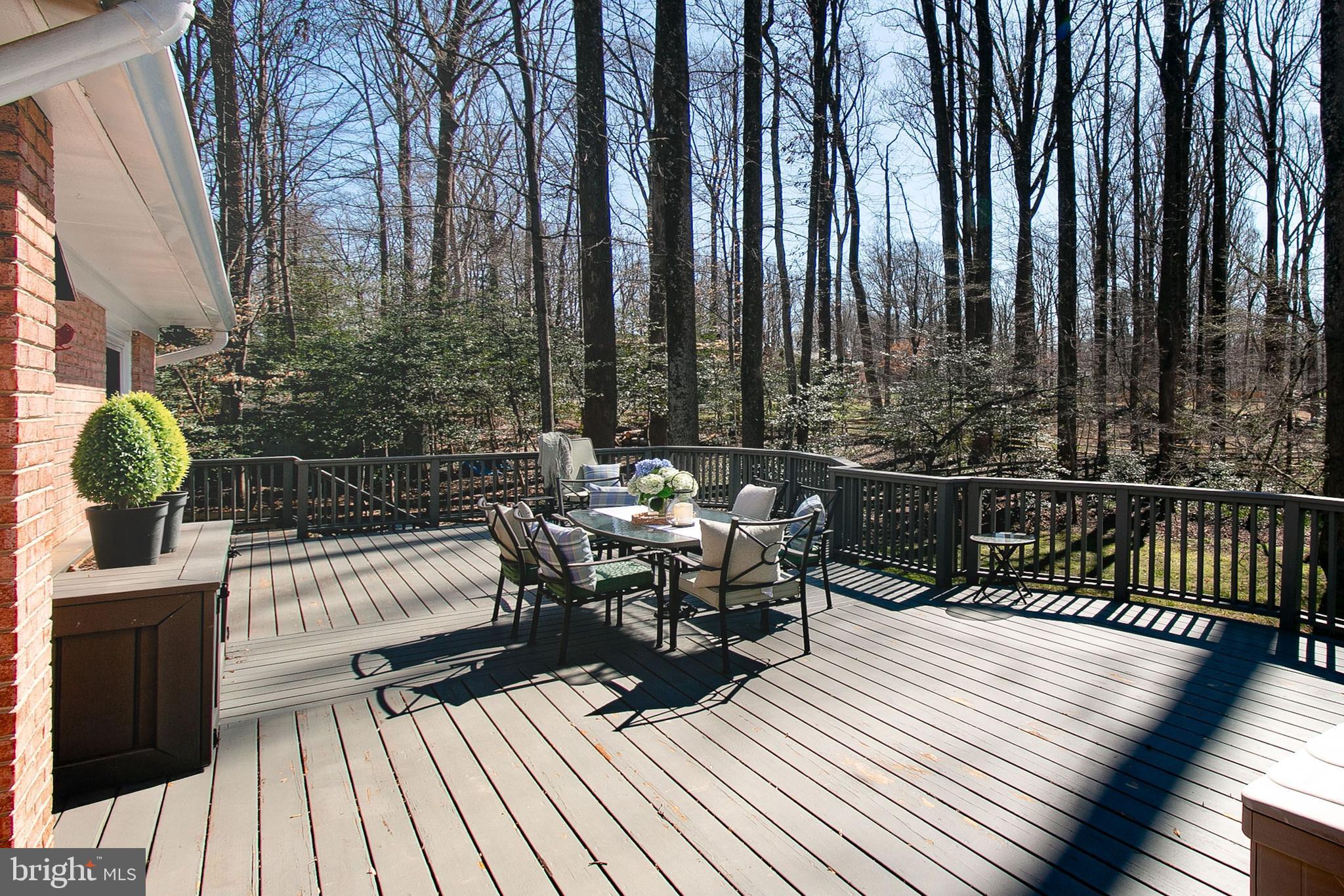 12415 Caisson Road Fairfax, VA 22030 - Photo 3 of 39 a view of balcony with chairs and wooden fence