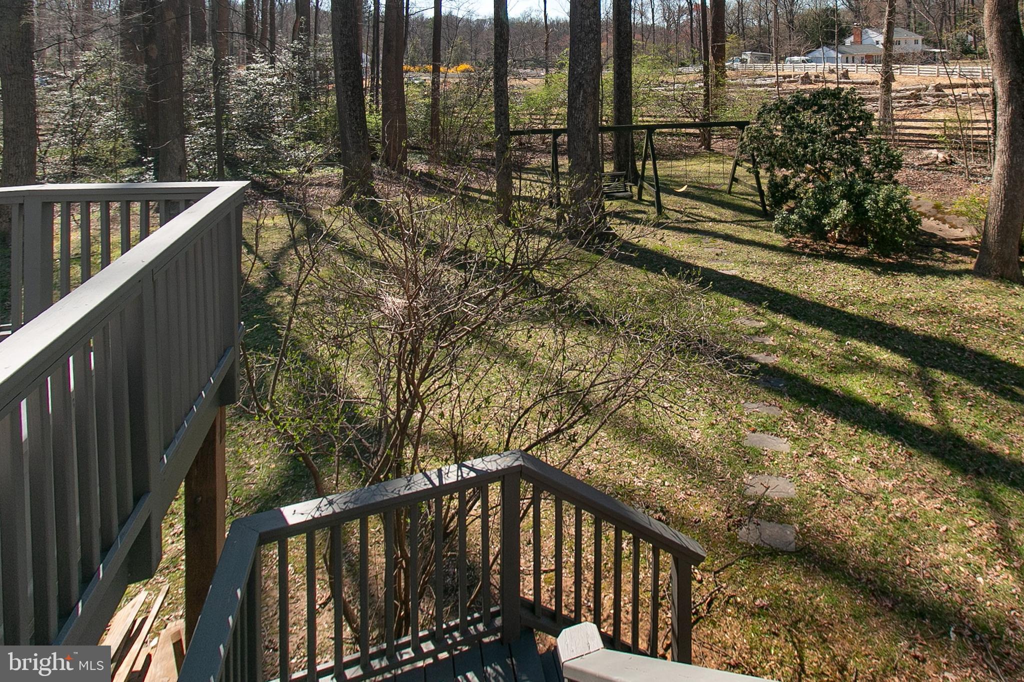 12415 Caisson Road Fairfax, VA 22030 - Photo 8 of 39 a view of a balcony with wooden fence