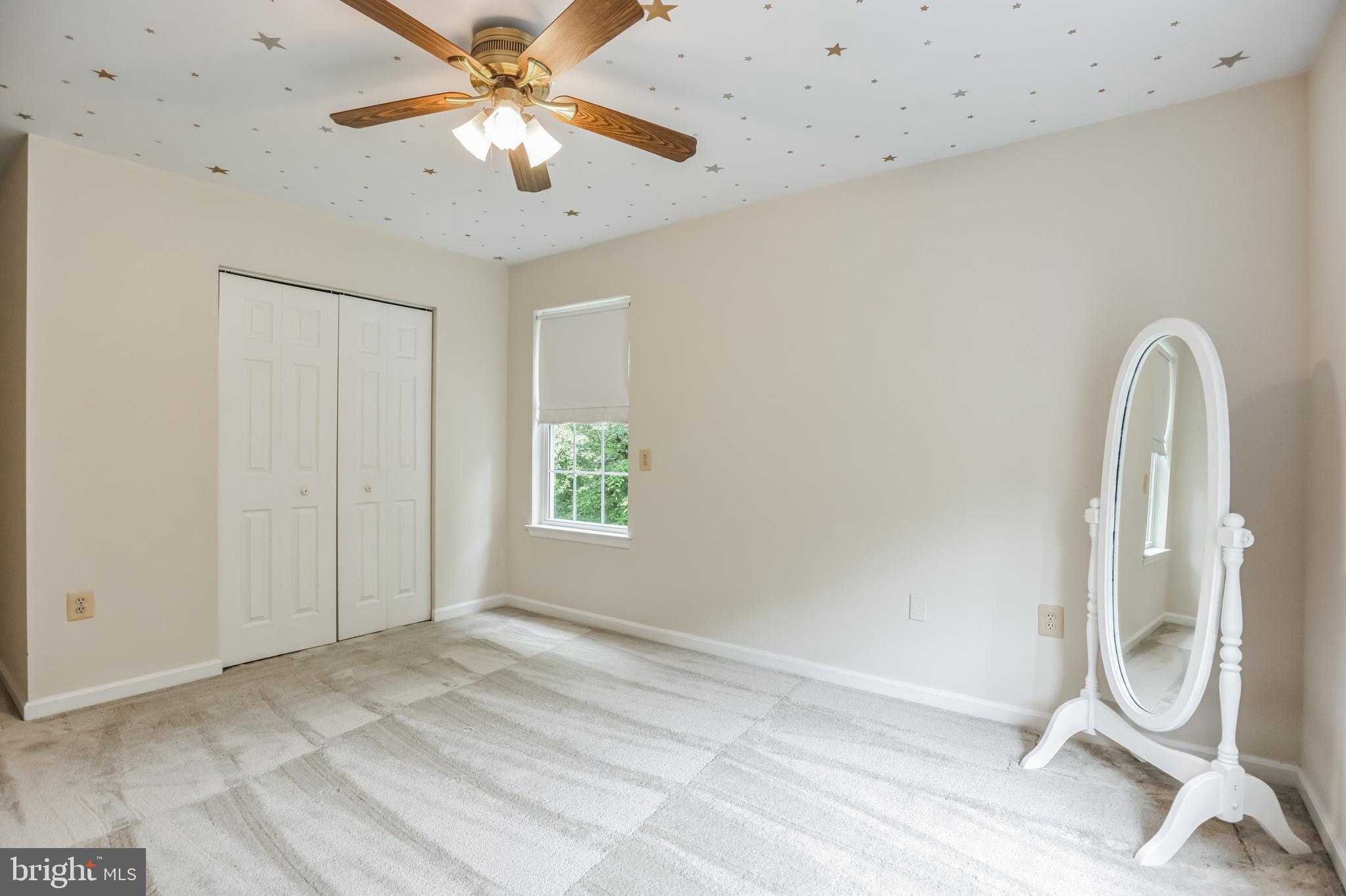 680 Small Reward Road Huntingtown, MD 20639 - Photo 19 of 40 a view of a room with gym equipment and a chandelier fan