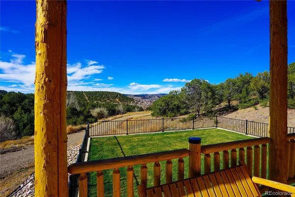 a view of a deck with a big yard