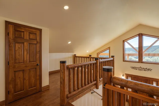a view of a hallway with windows