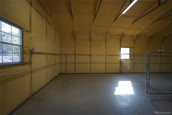 a view of a livingroom with an empty space and a window