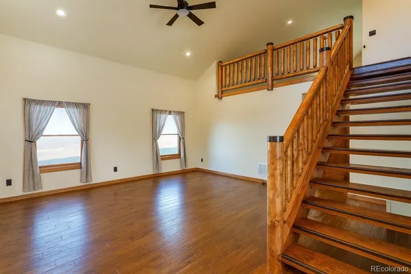 a view of an entryway with wooden floor