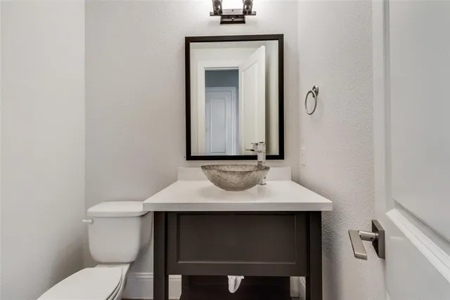a view of a room with wooden floor and windows