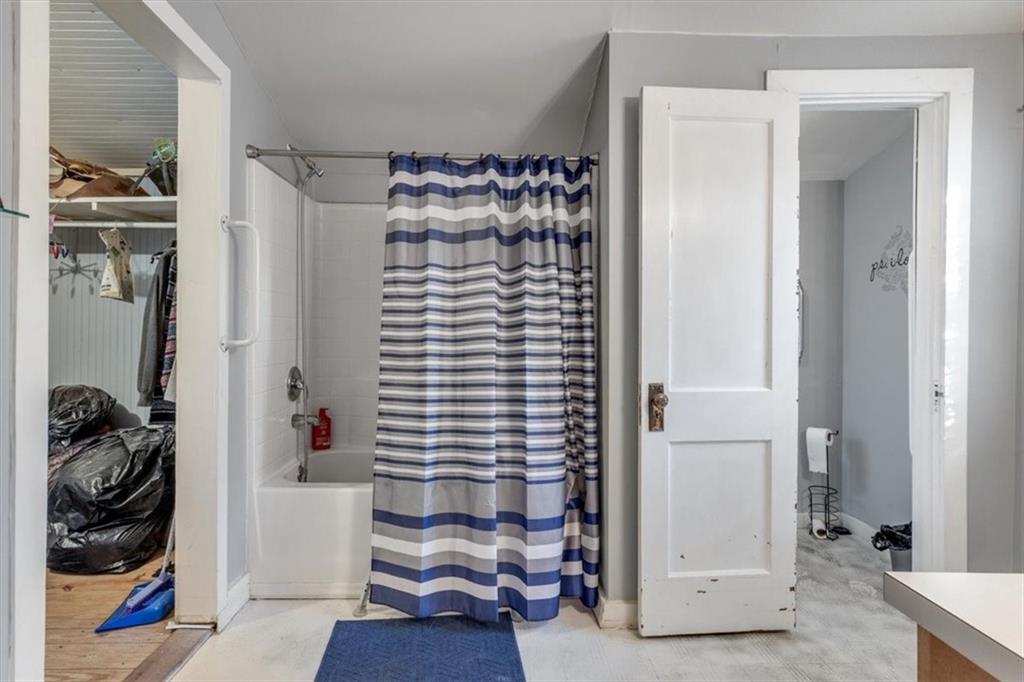 16049 Hopewell Road Alpharetta, GA 30004 - Photo 12 of 30 a view of walk in closet with clothes and shoes