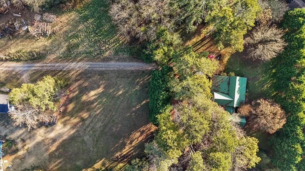 16049 Hopewell Road Alpharetta, GA 30004 - Photo 16 of 30 a backyard of a house with lots of green space
