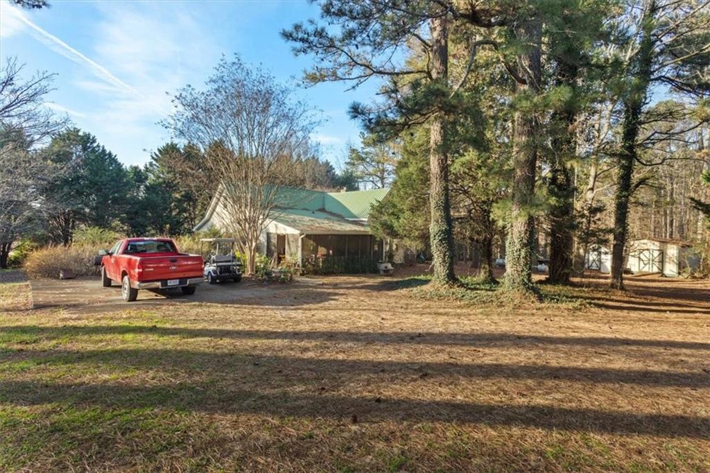 16049 Hopewell Road Alpharetta, GA 30004 - Photo 2 of 30 a view of a car parked on the side of a street