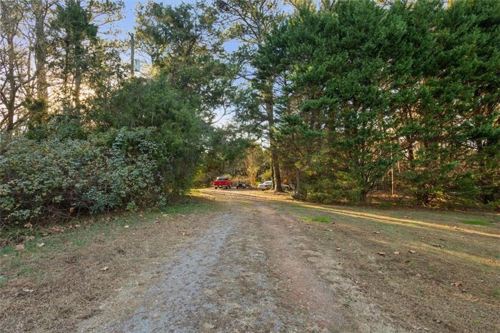 16049 Hopewell Road Alpharetta, GA 30004 - Photo 24 of 30 a view of a field with trees in background