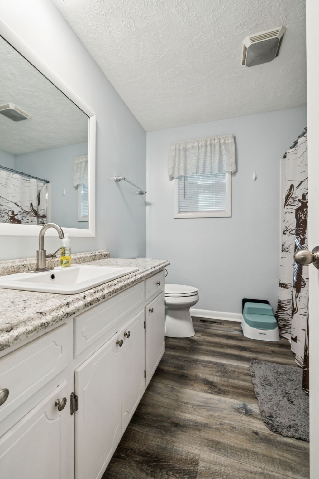 699 Rock Bridge Road Gallatin, TN 37066 - Photo 14 of 35 a bathroom with a granite countertop sink and a mirror