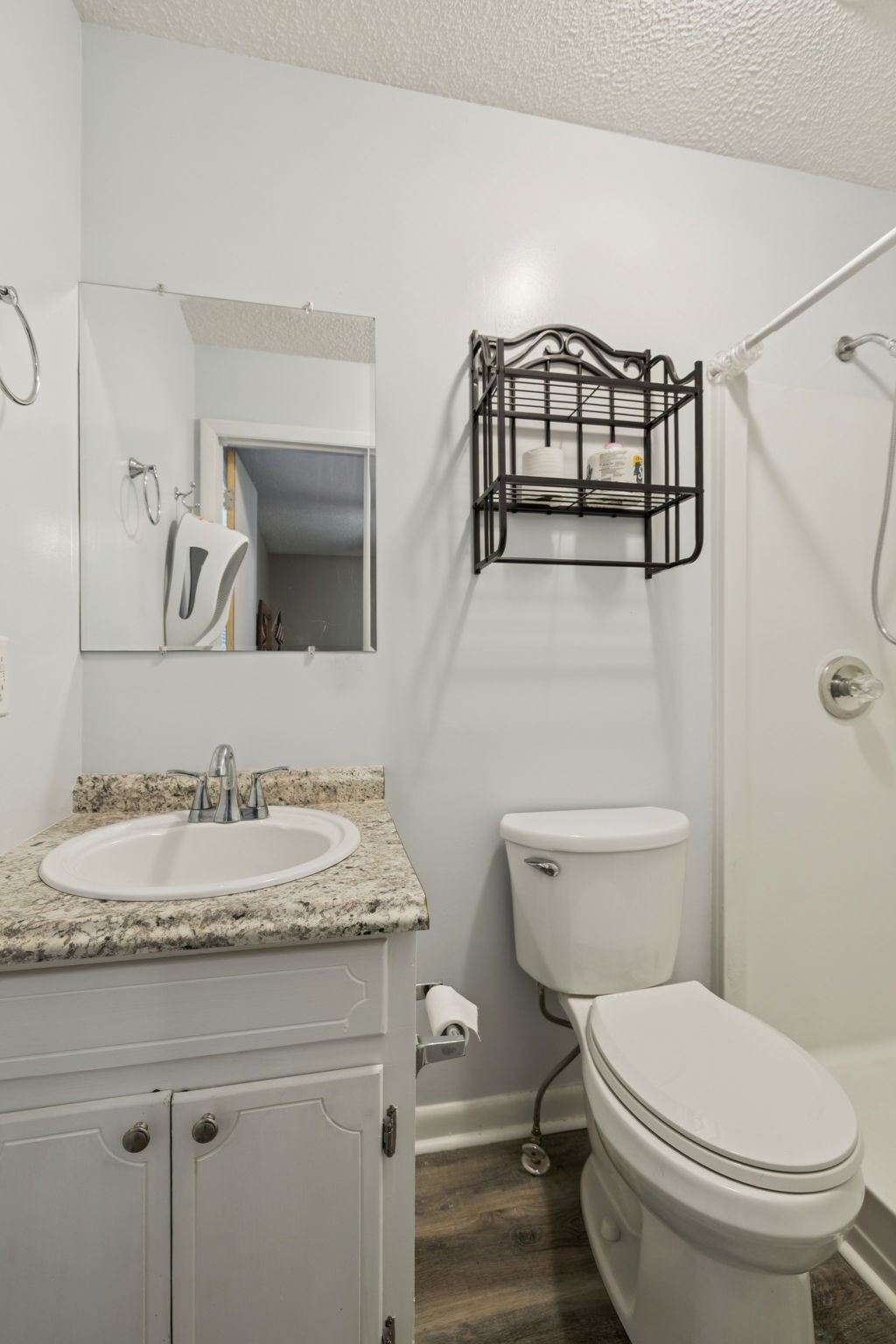 699 Rock Bridge Road Gallatin, TN 37066 - Photo 15 of 35 a bathroom with a granite countertop toilet sink and mirror