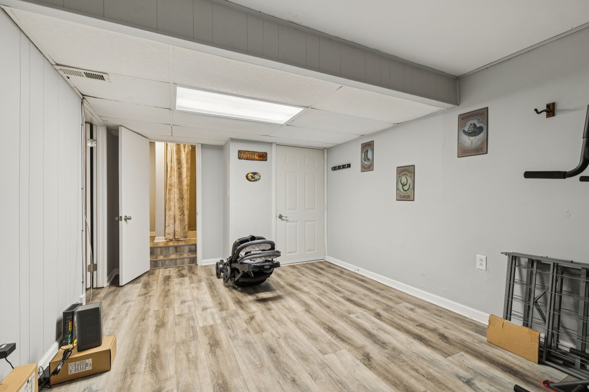 699 Rock Bridge Road Gallatin, TN 37066 - Photo 19 of 35 a view of a livingroom with a bed and wooden floor