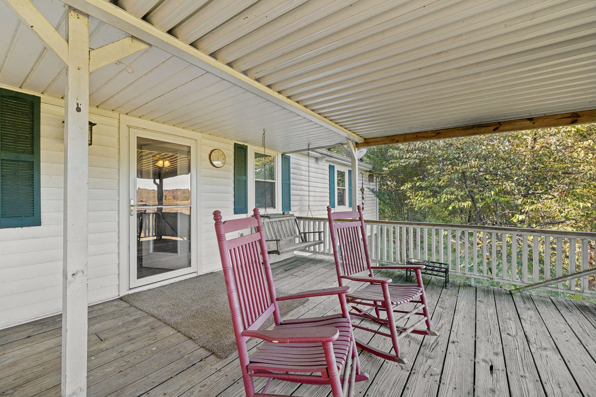 699 Rock Bridge Road Gallatin, TN 37066 - Photo 22 of 35 a view of a patio with table and chairs with wooden floor and fence