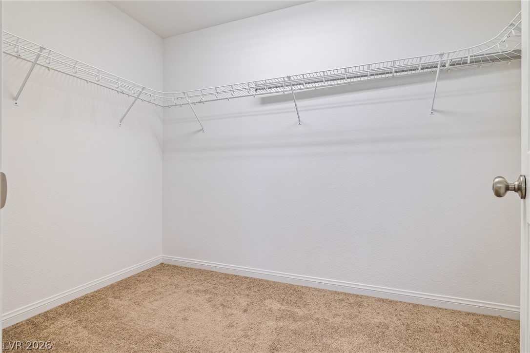 5510 Ripple Ridge Avenue Las Vegas, NV 89139 - Photo 30 of 45 This spacious closet offers ample storage and organization solutions.