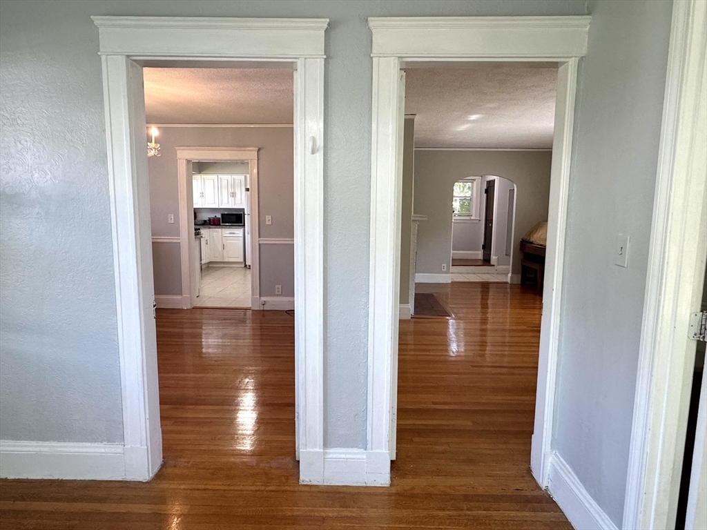 1639 Washington Street Newton, MA 02465 - Photo 8 of 20 a view of a hallway with wooden floor