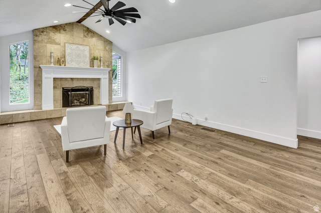 1320 Canyon Park Road Bountiful, UT 84010 - Photo 4 of 28 Sitting room with ceiling fan, healthy amount of natural light, light wood finished floors, and a tile fireplace
