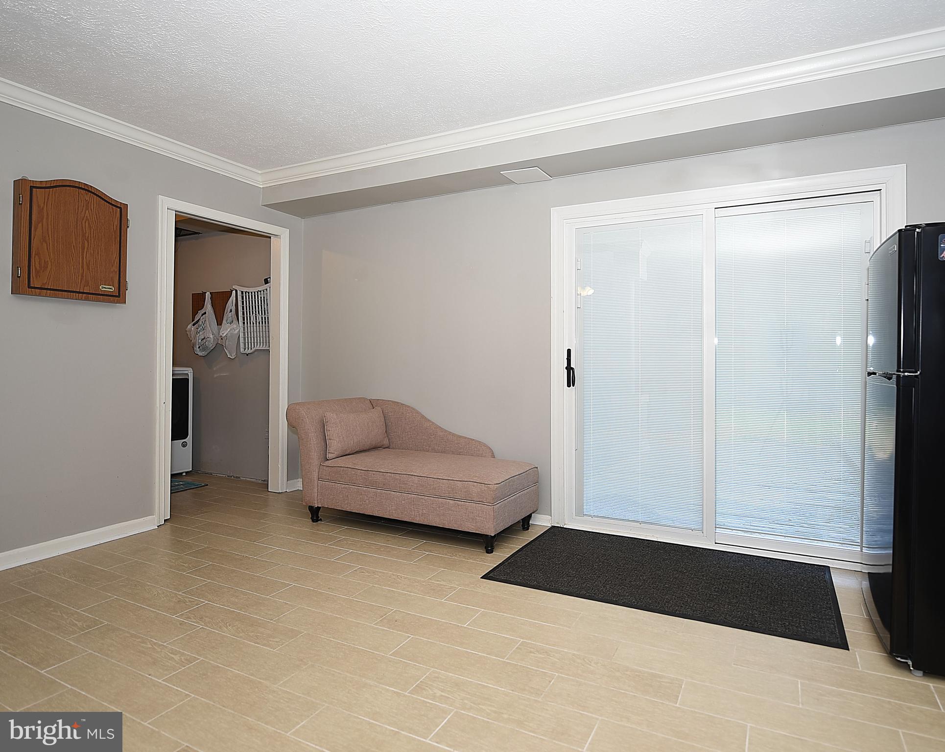 1817 Susquehanna Hall Road Whiteford, MD 21160 - Photo 26 of 57 Lower Level Family Room w/ Slider to Wood Patio