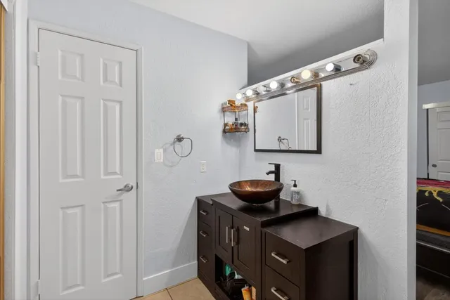 a bathroom with a sink and a mirror