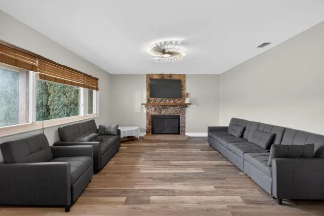 a living room with furniture and a fireplace