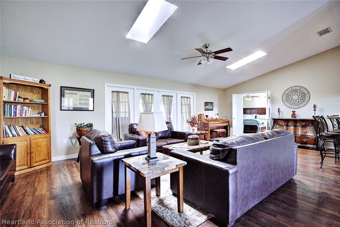3601 Divot Road Sebring, FL 33872 - Photo 9 of 31 a living room with furniture kitchen view and a table