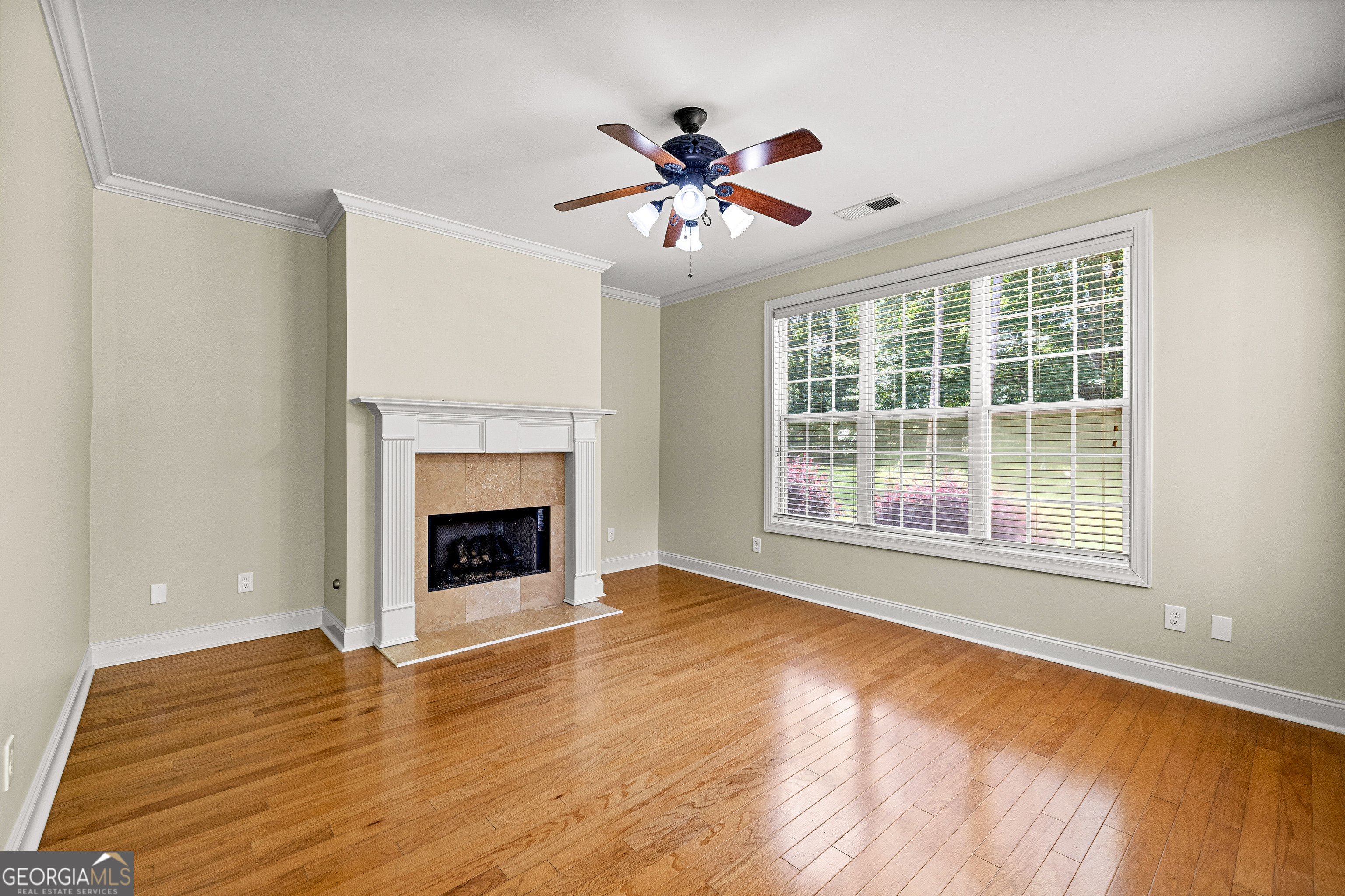 120 Shankhill Ridge Tyrone, GA 30290 - Photo 17 of 53 a view of an empty room with wooden floor fireplace and a window