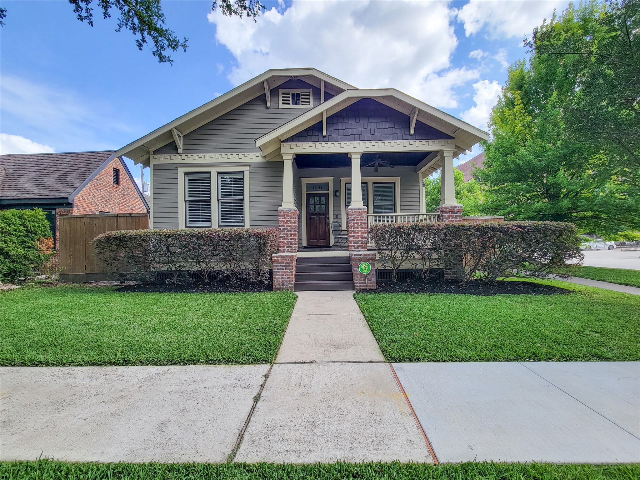 1140 West Cottage Street Houston, TX 77009 - Photo 1 of 37 a front view of a house with a yard