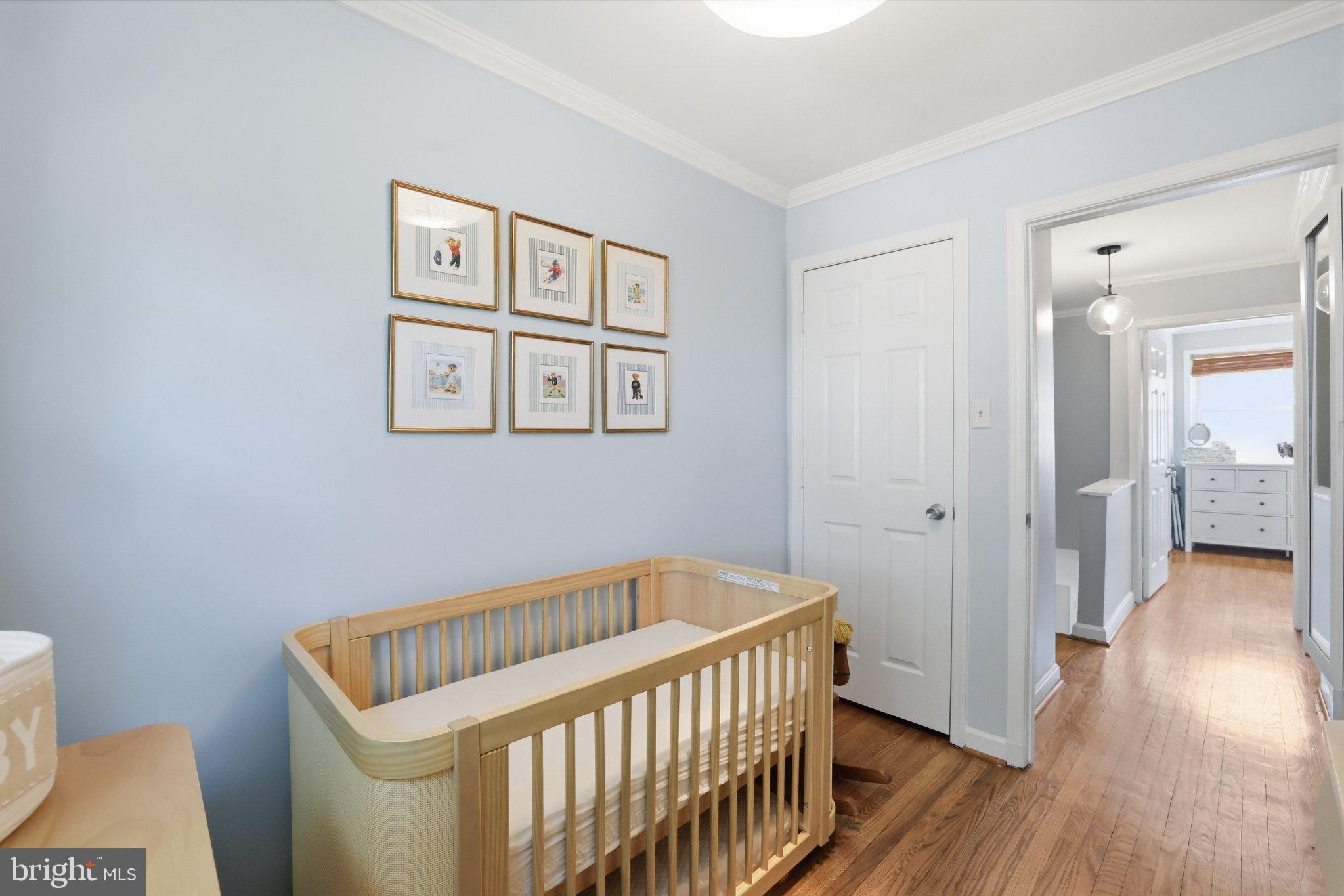 49 West Reed Avenue Alexandria, VA 22305 - Photo 5 of 29 Serene nursery with soft hues.