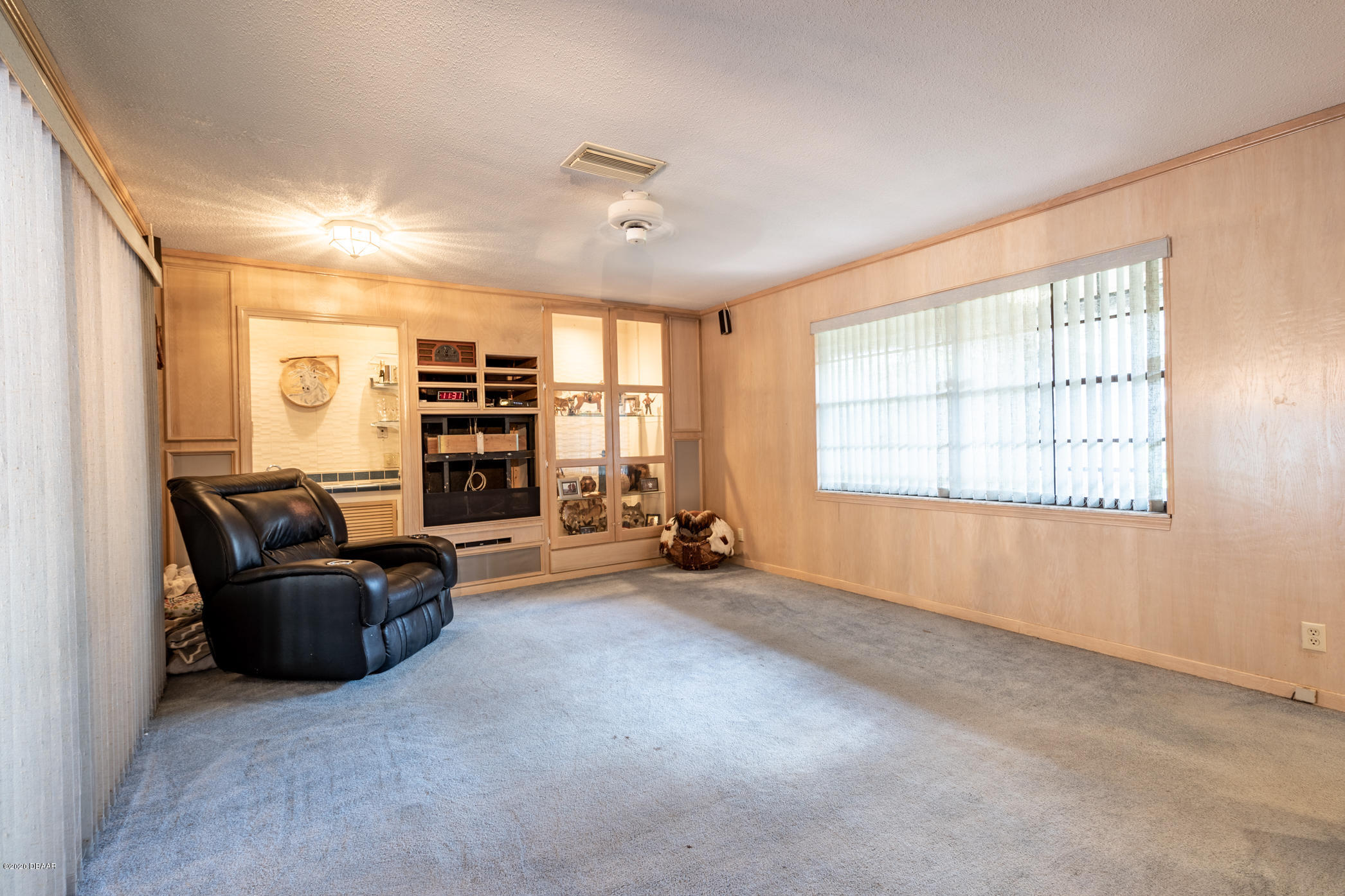 7 Twin River Drive Ormond Beach, FL 32174 - Photo 18 of 45 a living room with furniture and a window