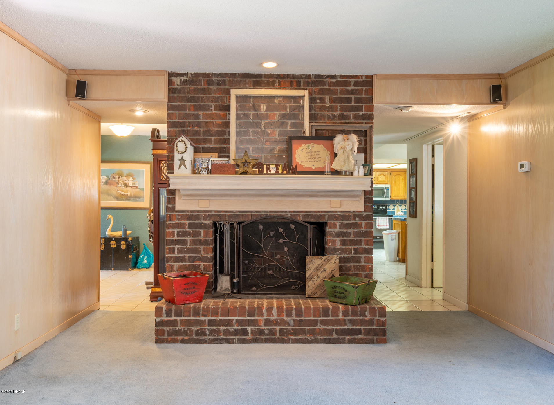 7 Twin River Drive Ormond Beach, FL 32174 - Photo 20 of 45 a living room with furniture and a fireplace