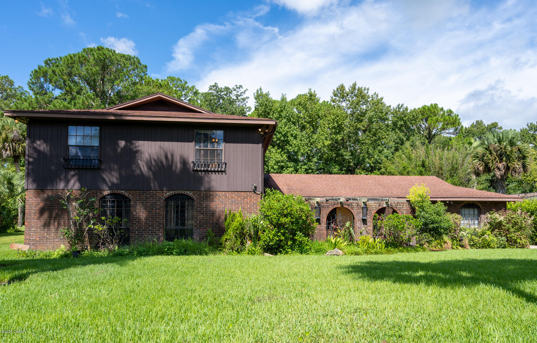 7 Twin River Drive Ormond Beach, FL 32174 - Photo 2 of 45 a backyard of a house with lots of green space
