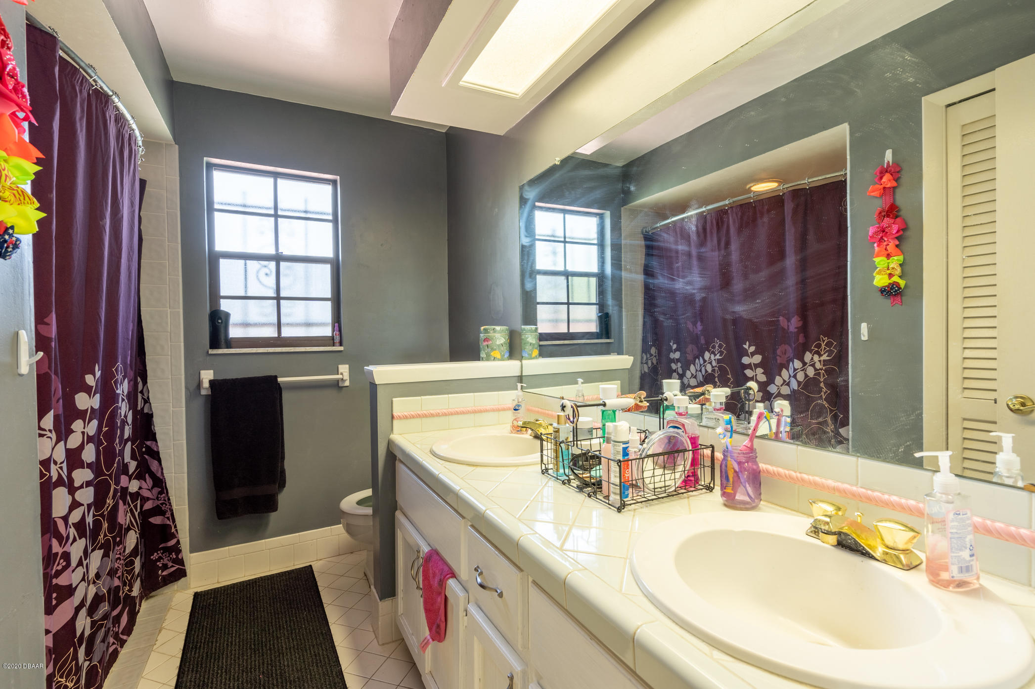7 Twin River Drive Ormond Beach, FL 32174 - Photo 29 of 45 a bathroom with a bathtub sink and window