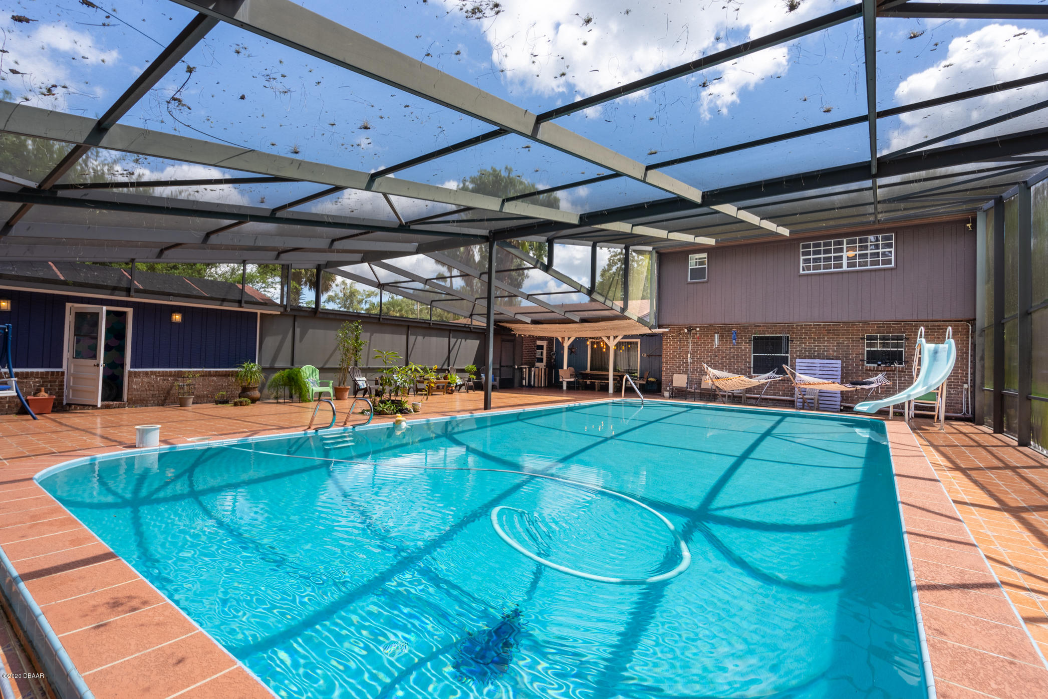 7 Twin River Drive Ormond Beach, FL 32174 - Photo 31 of 45 a view of a swimming pool with a patio