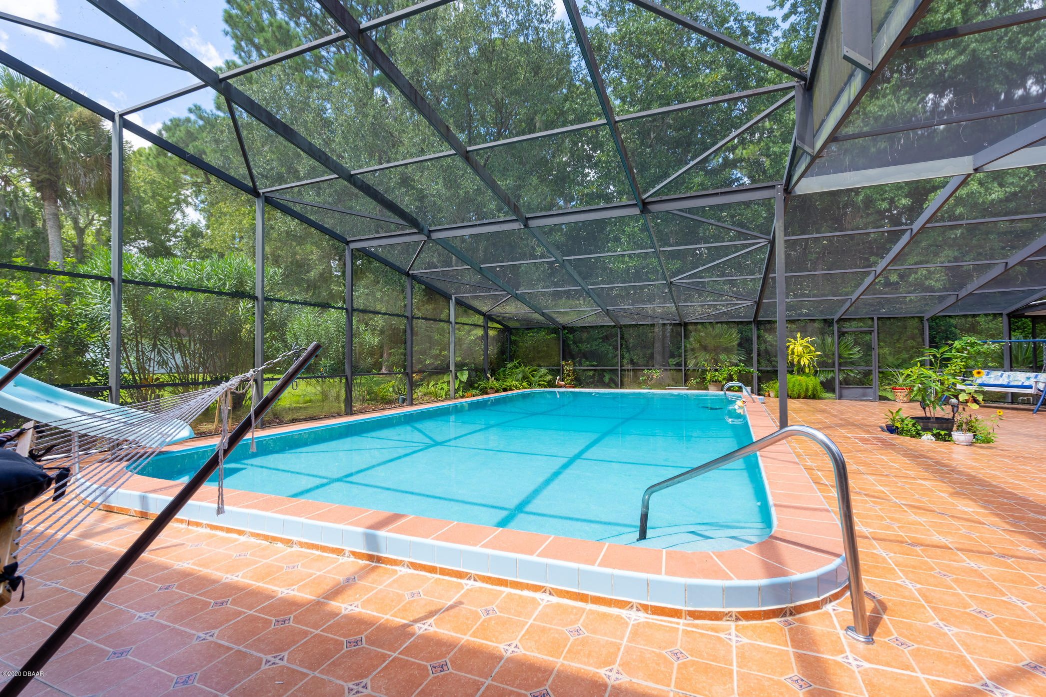 7 Twin River Drive Ormond Beach, FL 32174 - Photo 34 of 45 a view of a tennis court with umbrellas