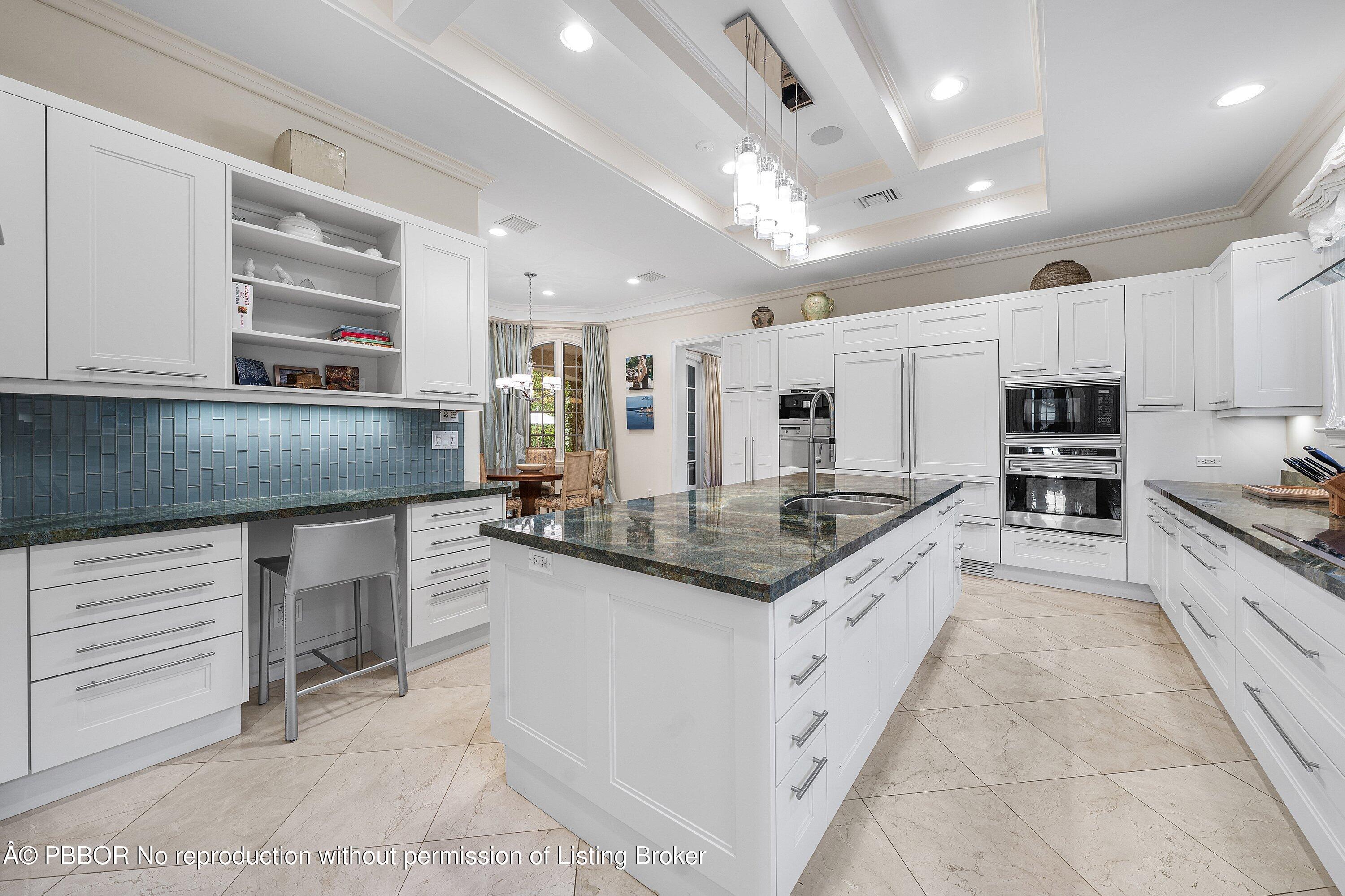 242 Wells Road Palm Beach, FL 33480 - Photo 16 of 54 a kitchen with stainless steel appliances granite countertop a stove and cabinets