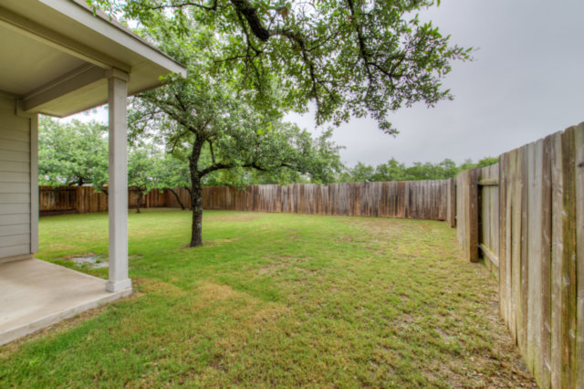 198 Stone View Trail Austin, TX 78737 - Photo 9 of 10 a backyard of a house with lots of green space