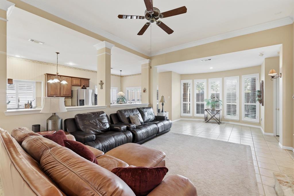 2012 Hayden Lane Corinth, TX 76210 - Photo 11 of 40 a living room with furniture and a large window