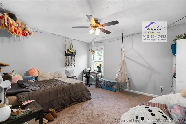 a bedroom with a bed and cabinets