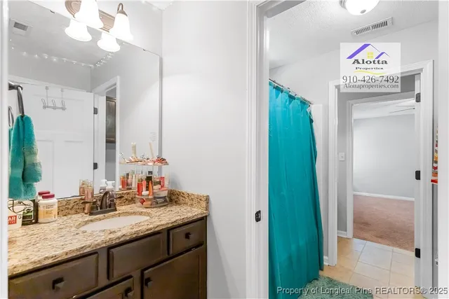 a bathroom with a sink a vanity and a mirror