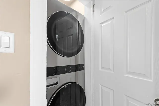 a close view of a utility room with dryer and washer