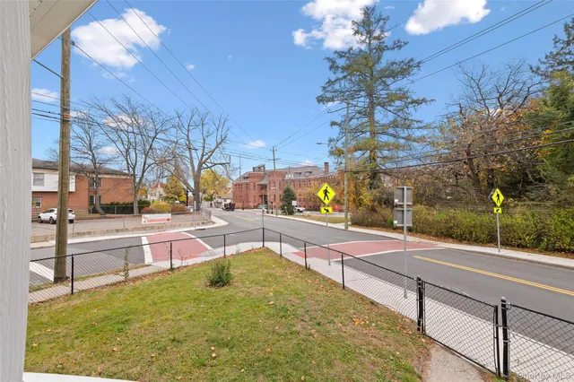 a swimming pool with outdoor seating and yard