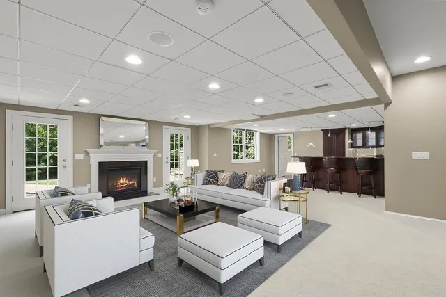 a bathroom with a granite countertop sink a toilet and shower