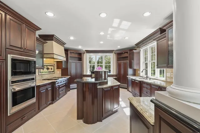 a kitchen with a refrigerator and a table